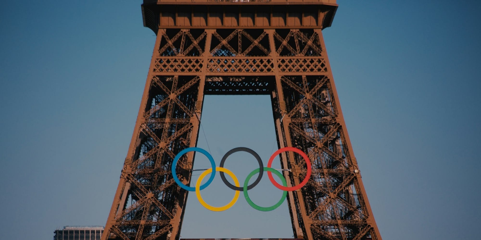 The eiffel tower with the olympic rings in front of it